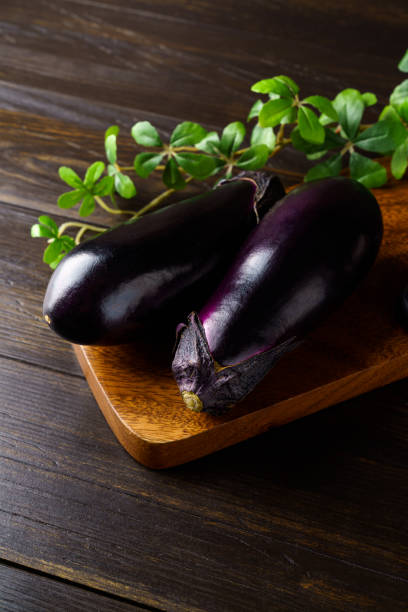 istock Fresh eggplant on wooden table 1343204352
