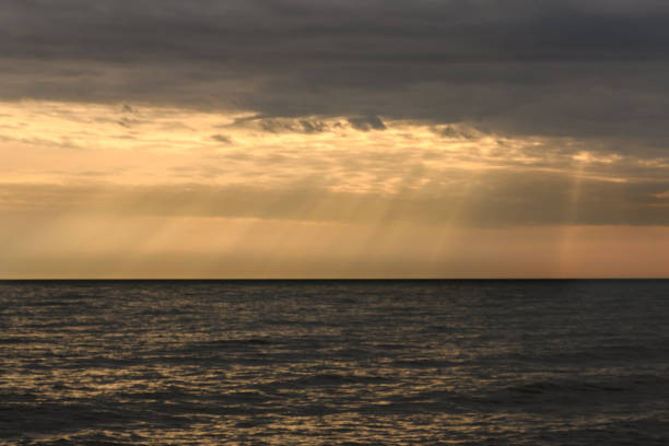 istock Cloudy sunset over Baltic Sea. Looks like rays from heaven 1343204551