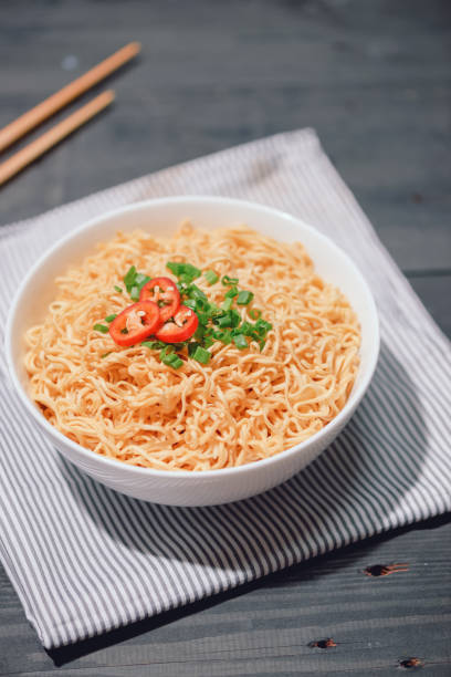 istock Asian ramen noodles in white bowl on the table. 1343204645