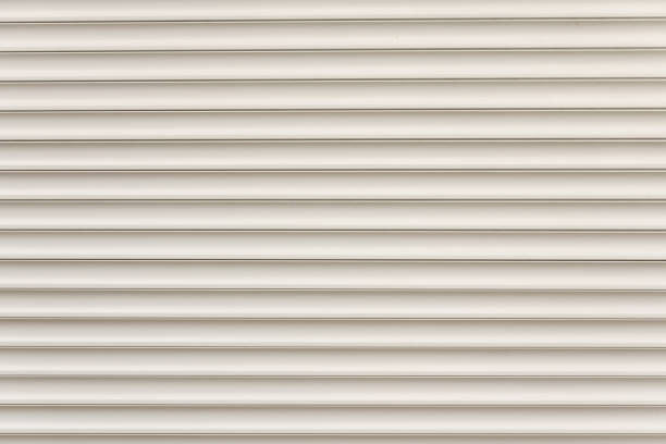 istock Roller door or roller shutter texture consist of steel slat in horizontal for background about industry, security, safety, architecture etc. Abstract background with horizontal graphic line or texture 1343206528