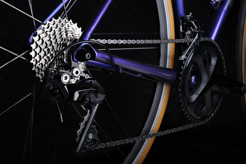 Detail of bicycle components. Close up cassette, chain and rear derailleur. Studio shot