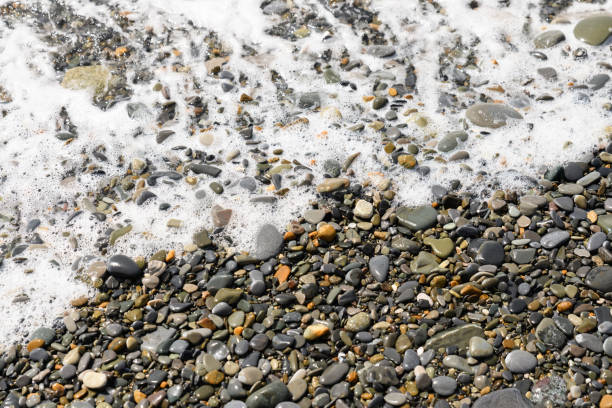 istock Pebble beach .Sea wave near the shore. 1343207709