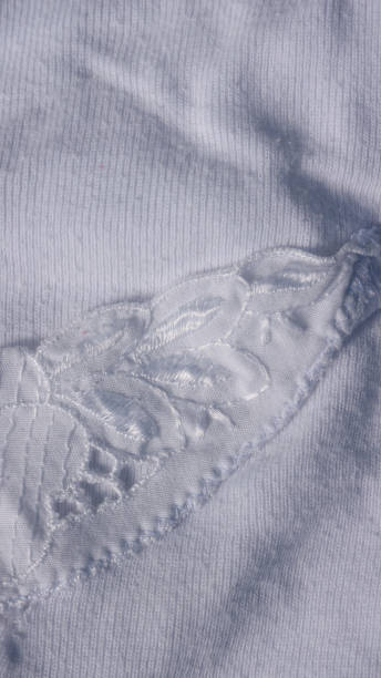 istock Crochet flower in old white cotton shirt 1343207874