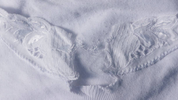 istock Crochet flower in old white cotton shirt 1343207915