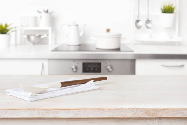 istock Cooking spoon and napkin on table with blurred kitchen background 1343213703