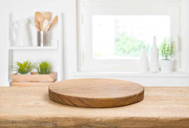 Food background concept with empty vintage cutting board on table stock photo