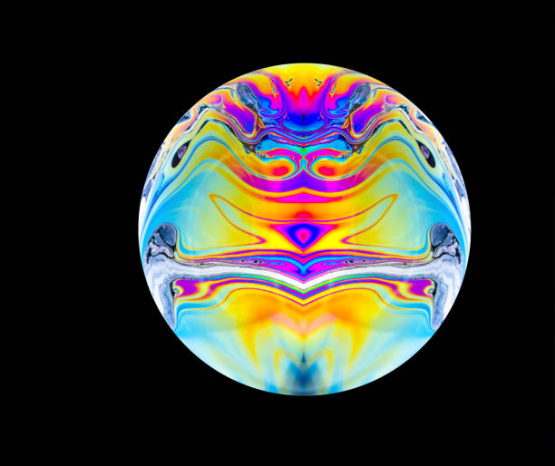 Close up of a abstract, soap bubble resembling a planet. Copy space on a black background.