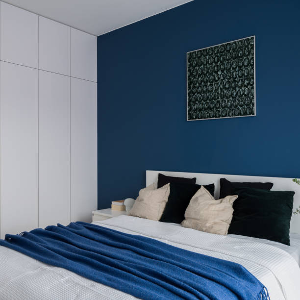 istock Cozy bed in modern bedroom 1343219015