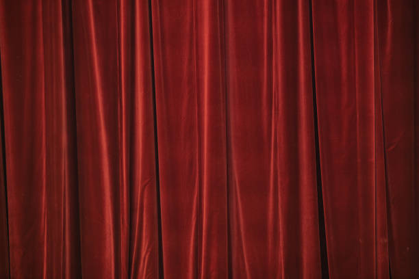istock Red curtain in theatre. Textured background 1343222801
