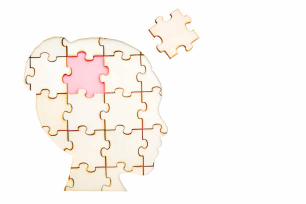 istock Woman's head jigsaw puzzle with the final missing piece isolated on white 1343230367
