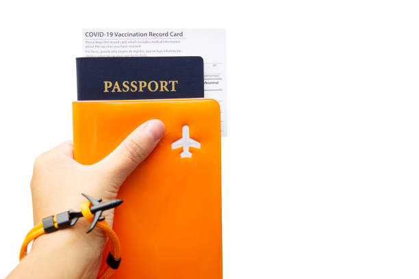 istock Covid-19 vaccination record card and passport in hand 1343230387