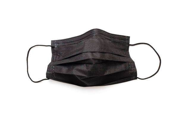 istock Protective, protecting black mask isolated on white. Black face mask for strong dress-code. 1343230730