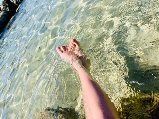 istock Boy’s legs in the sea 1343233619