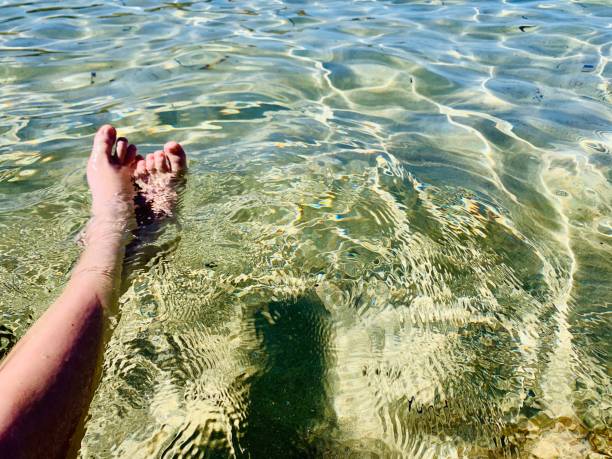 istock Boy’s legs in the sea 1343233717