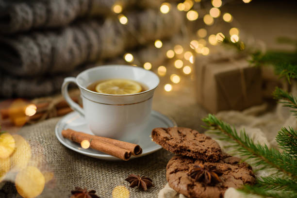 istock Cup of tea with lemon and cookies close-up with selective focus 1343234190