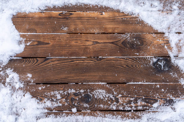 istock Winter background. Empty wooden plank with snow border, copy space for text 1343234200