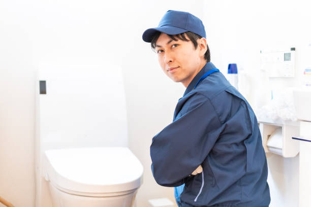 istock Technician doing toilet maintenance at home 1343234221