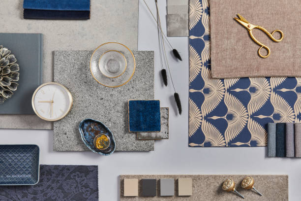 Flat lay of creative architect moodboard composition with samples of building, textile and natural materials and personal accessories. Top view, grey background, template. stock photo