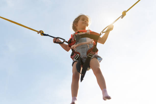 istock Child jumping child trampoline rubber bands 1343239034