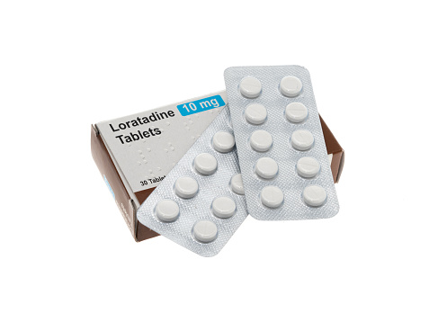 A generic box of Loratadine or allergy relief pills - white background