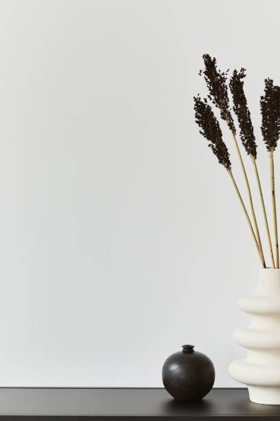 istock Stylish composition of creative room interior design with copy space, metal shelf, plants and personal accessories. Black and white concept. Template. 1343263374