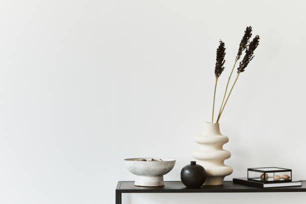 istock Stylish composition of creative room interior design with copy space, metal shelf, plants and personal accessories. Black and white concept. Template. 1343263386