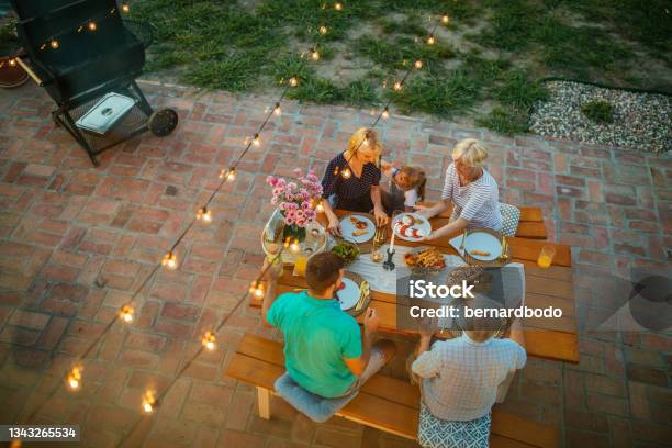 Happy Family Having Fun Together At Barbecue Backyard Party Stock Photo - Download Image Now