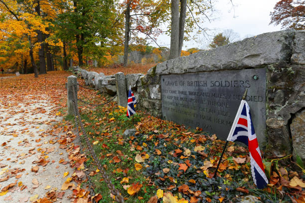 Closeup of the Gravestone of British Soldiers killed at North Bridge at Minute Man National Historical Park, Concord MA. Closeup of the Gravestone of British Soldiers killed at North Bridge at Minute Man National Historical Park, Concord MA. concord massachusetts stock pictures, royalty-free photos & images