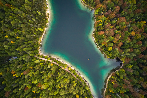 top view of nature landscape of beautiful forest and clear blue lake