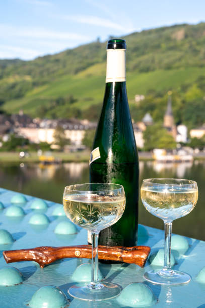 istock White quality riesling wine served on old bridge across Mosel river with view on old German town in sunny day 1343273439