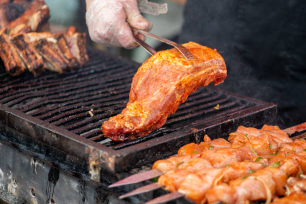 istock Chef grill barbecue meat and ribs outdoors. BBQ meat 1343275262