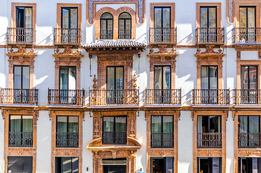 A facade of old tenement house in Seville, Andalusia, Spain