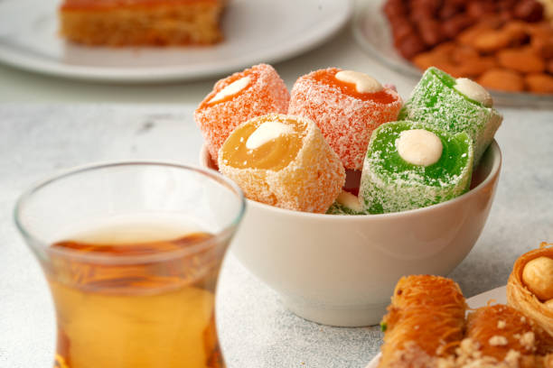 istock Various Turkish sweets and cup of tea on white textured background 1343277794
