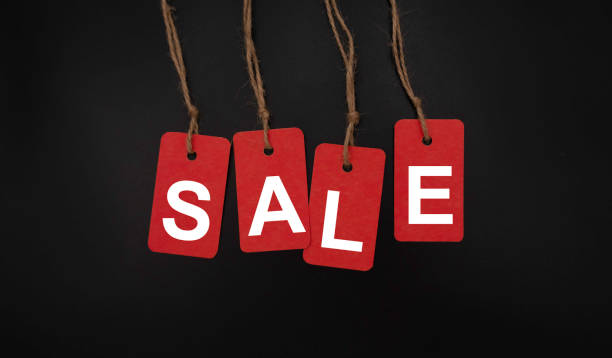 istock red labels with SALE on black background, template with copy space, Black Friday concept 1343283462