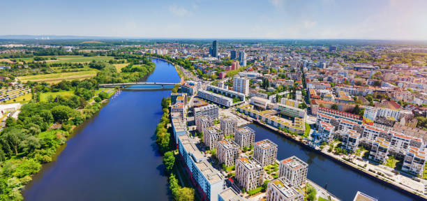 Modern new build properties by the water in Offenbach am Main harbor, Hesse: Development of a new residential area in a city with condominiums and apartments stock photo