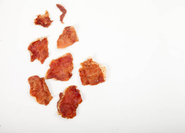istock Pieces of jerky on a white plate. 1343284661