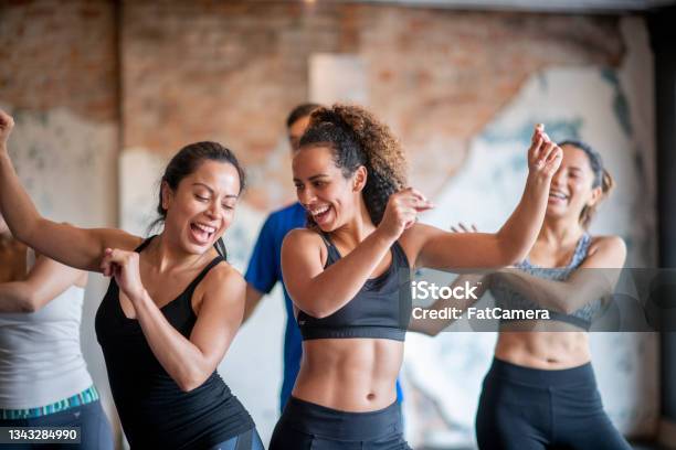 Hispanic Group Dance Fitness Class Stock Photo - Download Image Now - Exercising, Women, Dancing