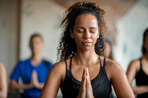 istock Beautiful Woman in a Hispanic Yoga Class 1343285010