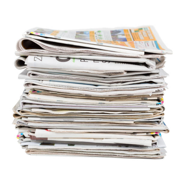 Pile of generic newspapers isolated on white background