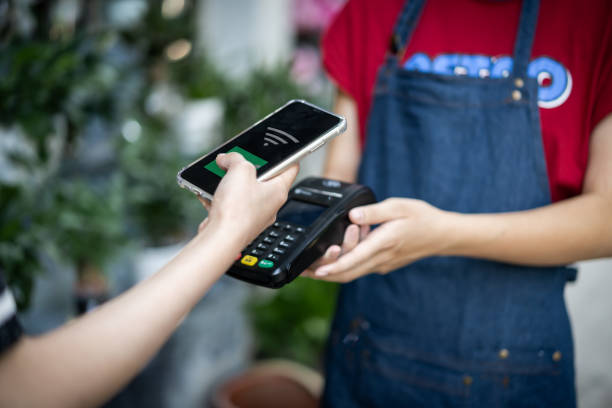 istock Make contactless payments with your phone in a store 1343286286