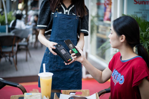 istock Make contactless payments with your phone in a store 1343286380