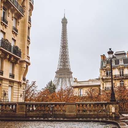 Autumn in Paris - a narrow street with ancient architecture and overlooking the Eiffel Tower - observation deck