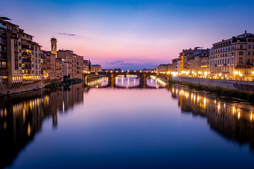 Long exposure photo of Florence old bridge and arno river