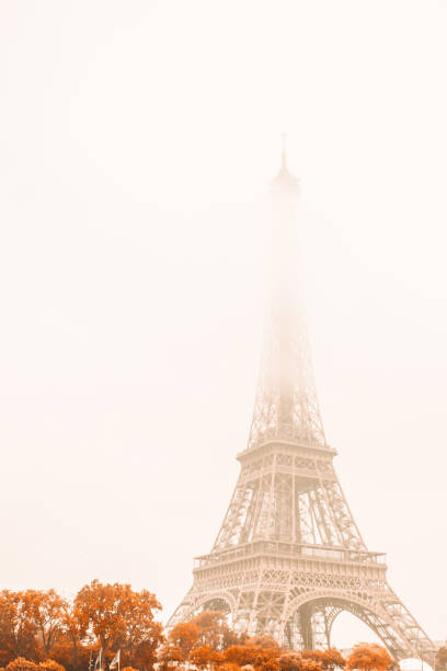 Eiffel Tower in the fog on a cloudy autumn day