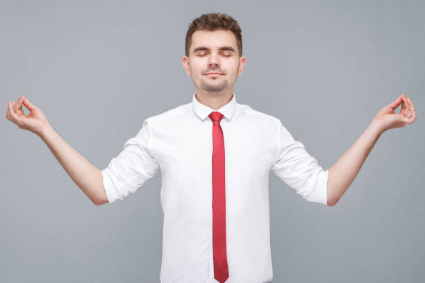 istock man standing in yoga pose and try to relaxing. 1343292347