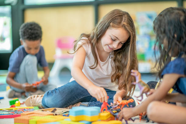 istock Preschool Children Playing on the Floor Together 1343292611