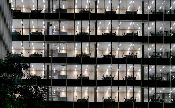 istock Empty workstations in an office building moments after finishing the workday for the night 1343295200
