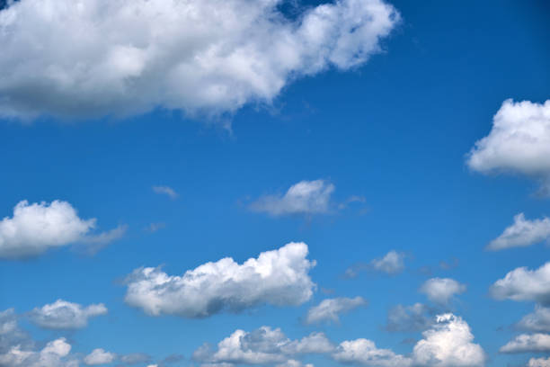 Bright landscape of white puffy cumulus clouds on blue clear sky. Bright landscape of white puffy cumulus clouds on blue clear sky. stratosphere meteorology climate air stock pictures, royalty-free photos & images