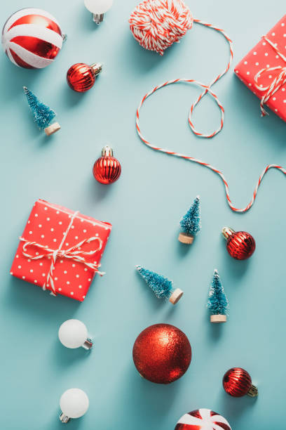 istock Christmas classic decorations and gift boxes on blue background. Vintage style. Flat lay, top view. 1343297182