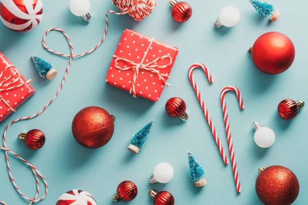istock Christmas composition with red classic decorations on blue background. Flat lay, top view. Vintage, retro style greeting card. 1343297184